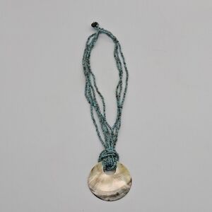 Elegant Blue Beaded Necklace with Shell Pendant